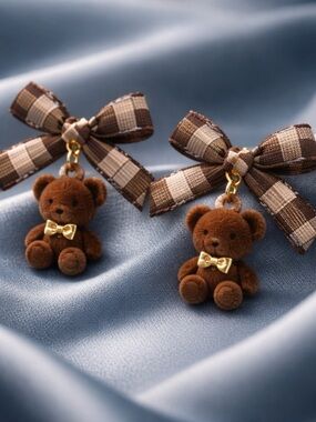 pair of adorable bow teddy bear earrings